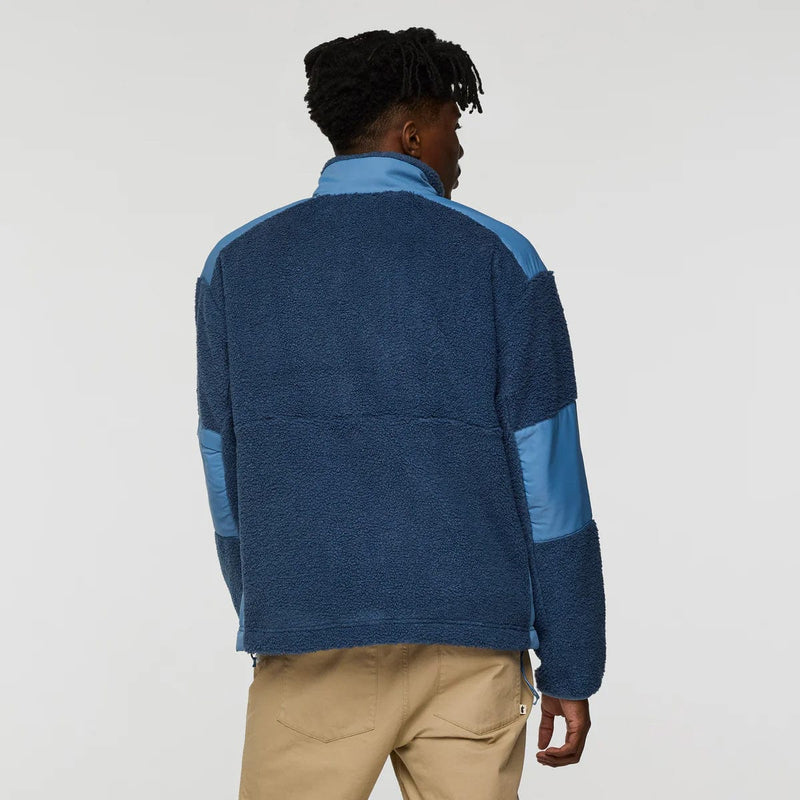 Load image into Gallery viewer, Person wearing a blue and gray pullover with beige pants on a white background
