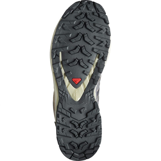 Close-up of a hiking shoe sole with tread pattern on a white background