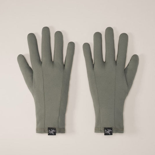 Pair of gray gloves with brand logo on a light beige background