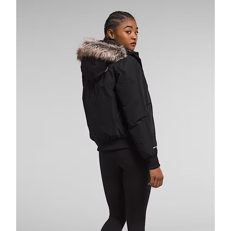 Load image into Gallery viewer, Person wearing a black jacket with fur hood on a gray background
