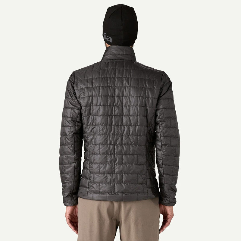 Load image into Gallery viewer, Person wearing a gray quilted jacket and black beanie on a white background
