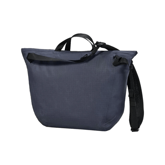 Blue tote bag with black straps on a white background