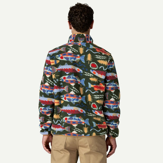 Person wearing a colorful fish-patterned jacket on a white background