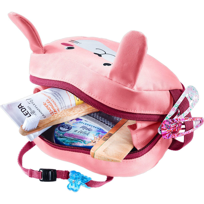 Load image into Gallery viewer, Pink children's backpack with animal ears filled with toiletries on a white background
