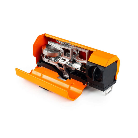 Close-up of a mechanical device with orange and black components on a white background