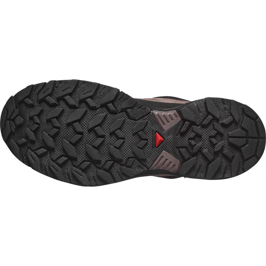 Close-up of a hiking shoe sole with tread pattern on a white background