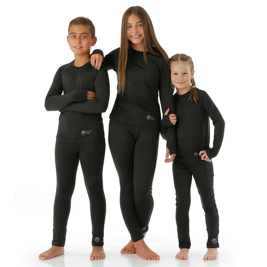 Three children wearing black wetsuits on a white background