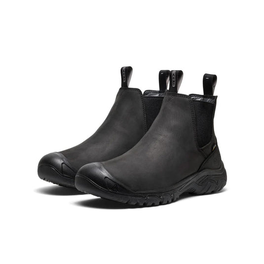 Pair of black Chelsea boots on a white background