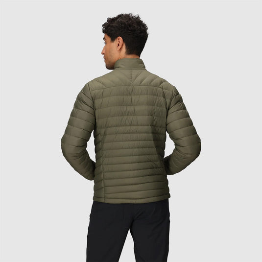 Person wearing a green puffer jacket on a light gray background