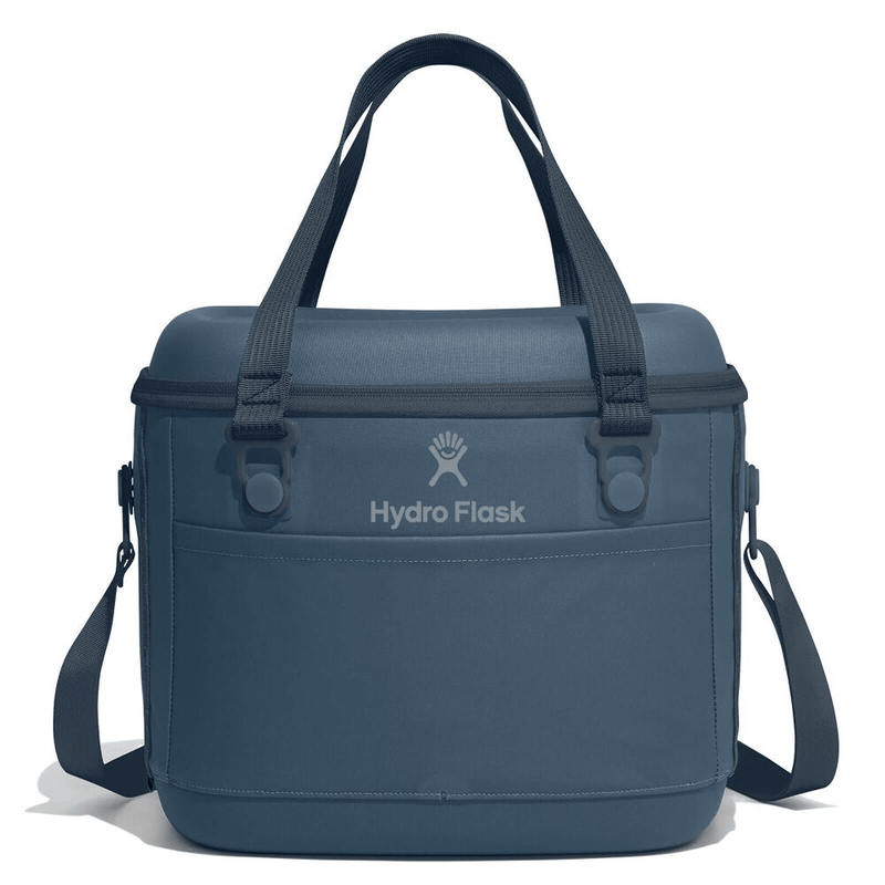 Load image into Gallery viewer, A blue Hydro Flask cooler bag with dual top handles, a detachable shoulder strap, and the Hydro Flask logo printed on the front, set against a plain white background.
