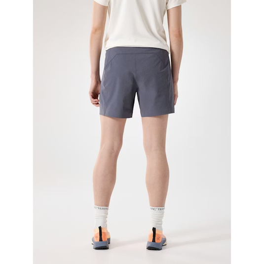 Person wearing gray shorts on a white background