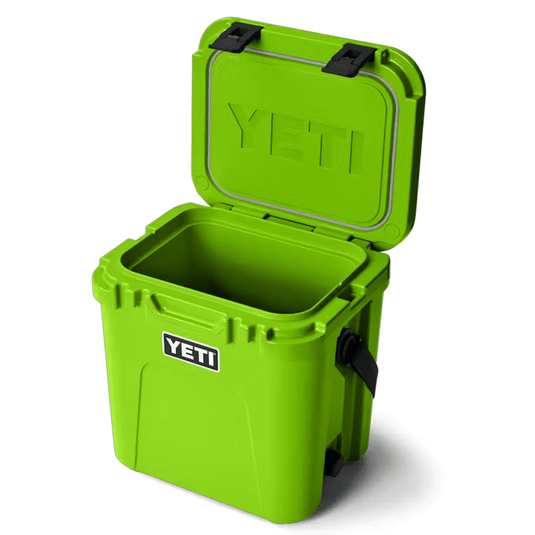 Green YETI cooler with open lid on a white background