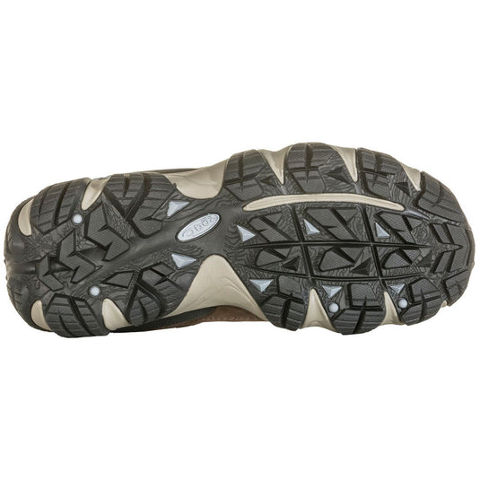 Close-up of a hiking shoe sole with brand logo on a white background