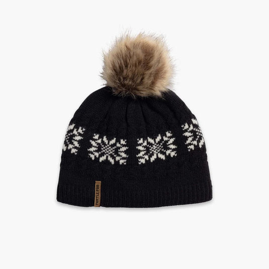 Black knit beanie with snowflake patterns and a fur pom-pom on a white background