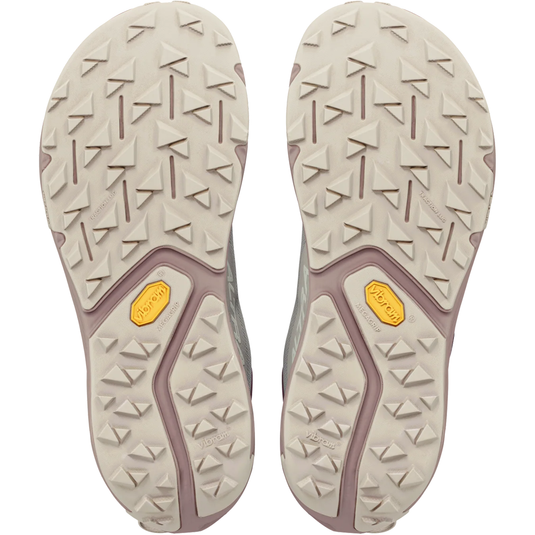 Close-up of the sole of a shoe with a textured pattern on a white background