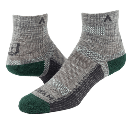 Pair of gray ankle socks with green toes and heels on a white background