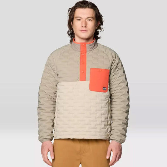 Man wearing a beige and orange jacket on a plain background