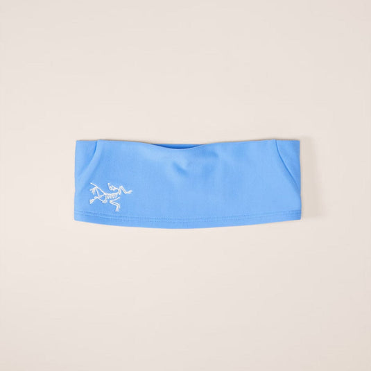 Blue headband with a logo on a beige background