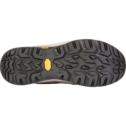 Close-up of a shoe sole with a textured pattern and a visible brand logo on a white background