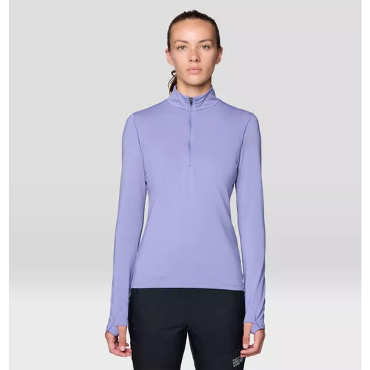 Woman wearing a light purple long-sleeve athletic top on a white background