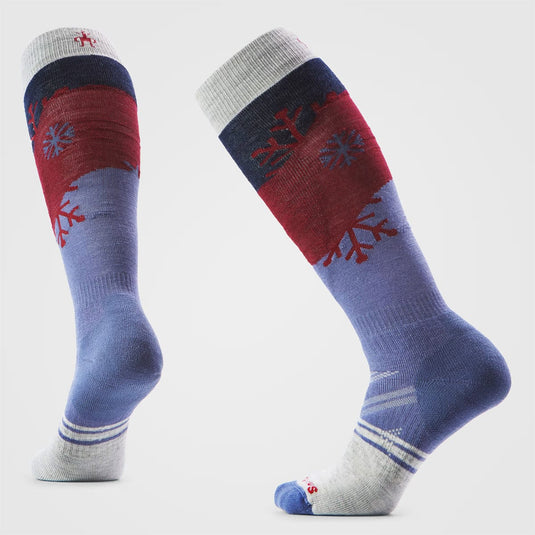 Pair of colorful socks with snowflake design on a light gray background
