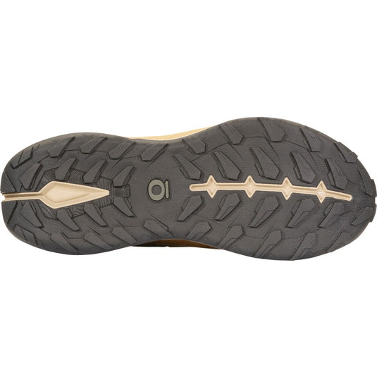 Close-up of a shoe sole with tread pattern and brand logo on a white background
