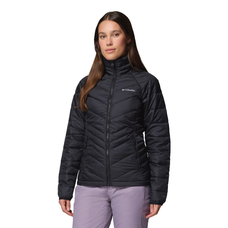 Load image into Gallery viewer, Woman wearing a black Columbia jacket on a white background
