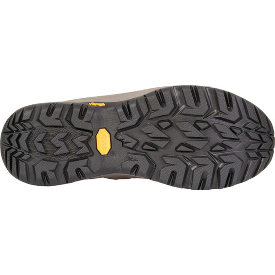 Close-up of a shoe sole with a textured pattern and a yellow logo on a white background