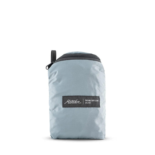 Light blue duffel bag with a black zipper and brand label on a white background
