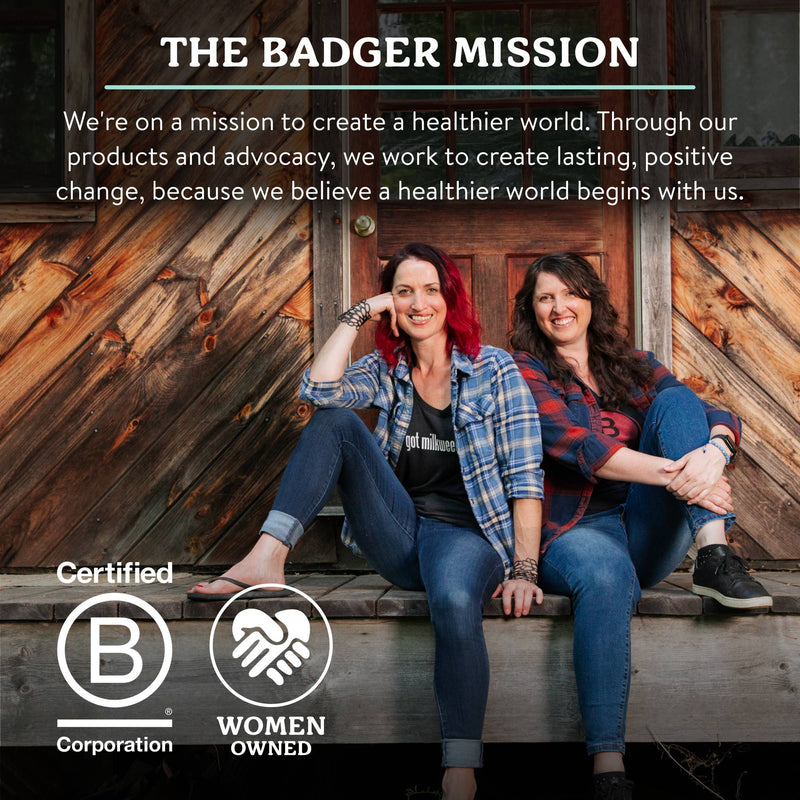 Load image into Gallery viewer, Two women sitting on a wooden step with text about 'The Badger Mission' and certification logos.
