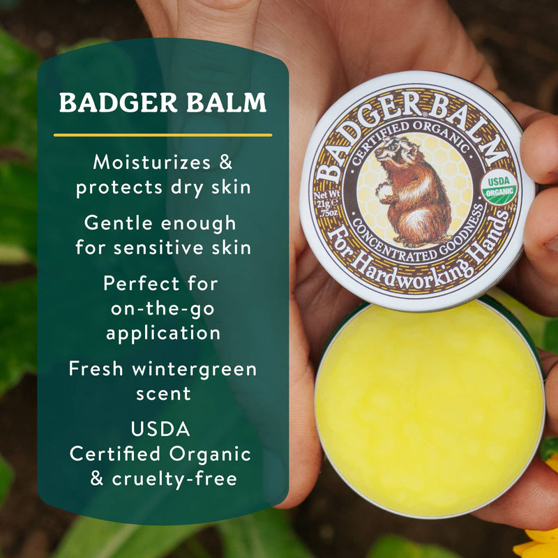 Load image into Gallery viewer, Badger Balm container held by a hand with product description text on a green background
