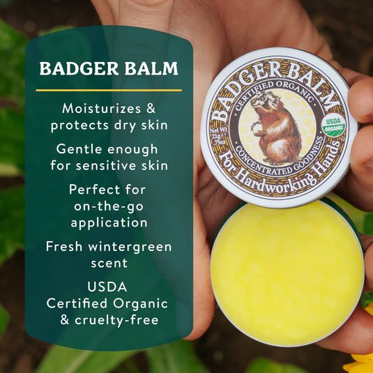 Badger Balm container held by a hand with product description text on a green background