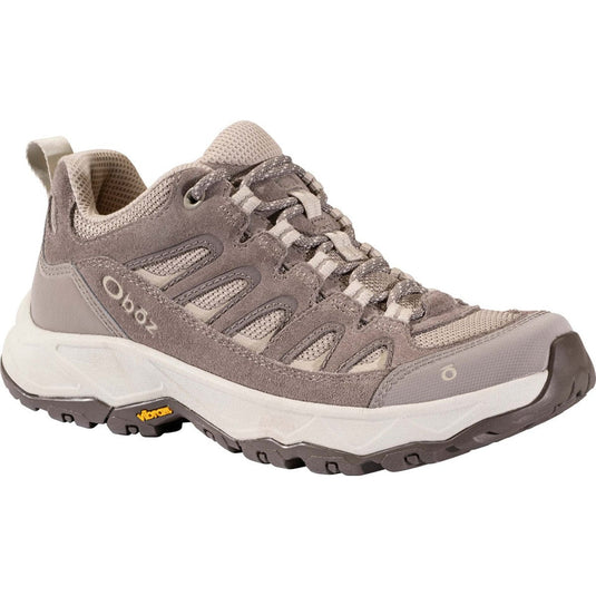 Gray hiking shoe with brand logo on a white background
