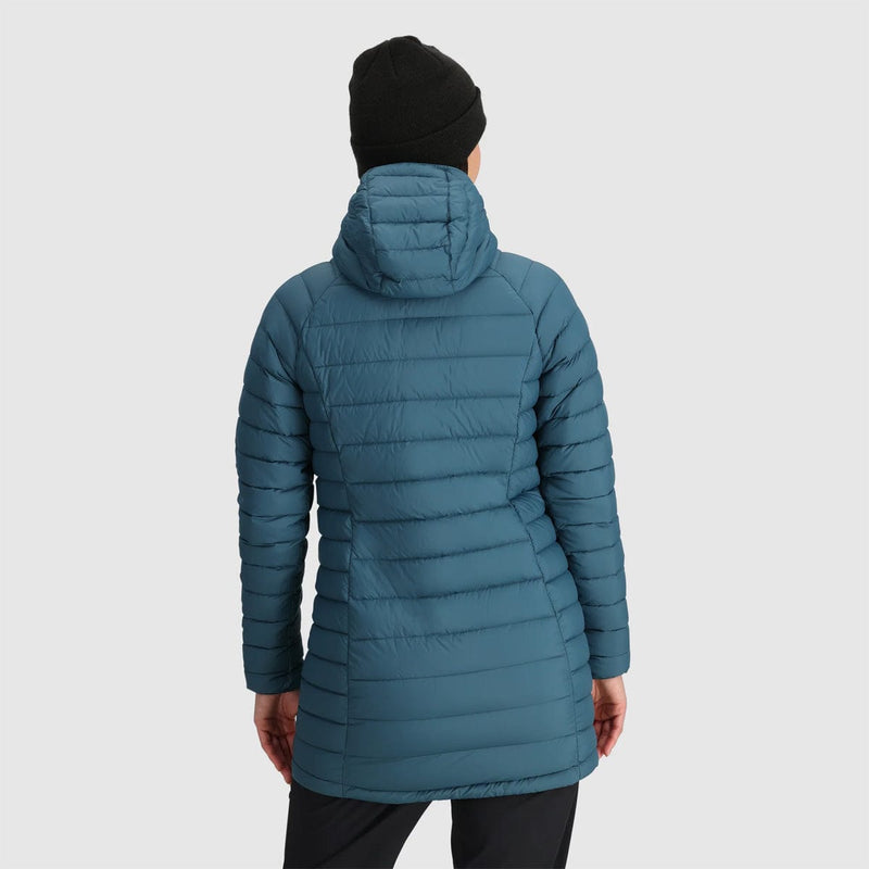 Load image into Gallery viewer, Person wearing a blue puffer jacket on a light gray background
