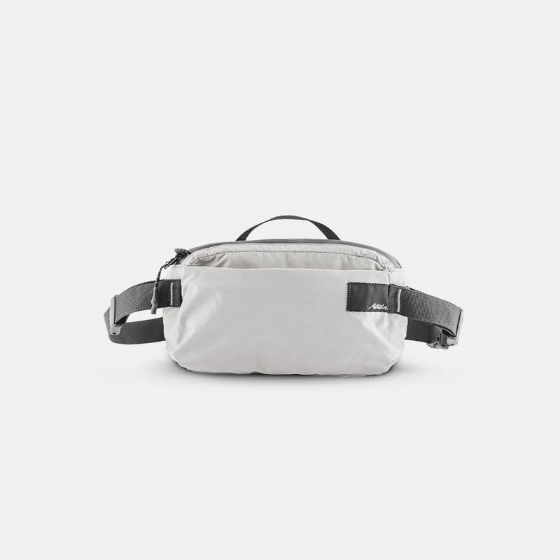 Load image into Gallery viewer, White waist bag with black straps on a light gray background
