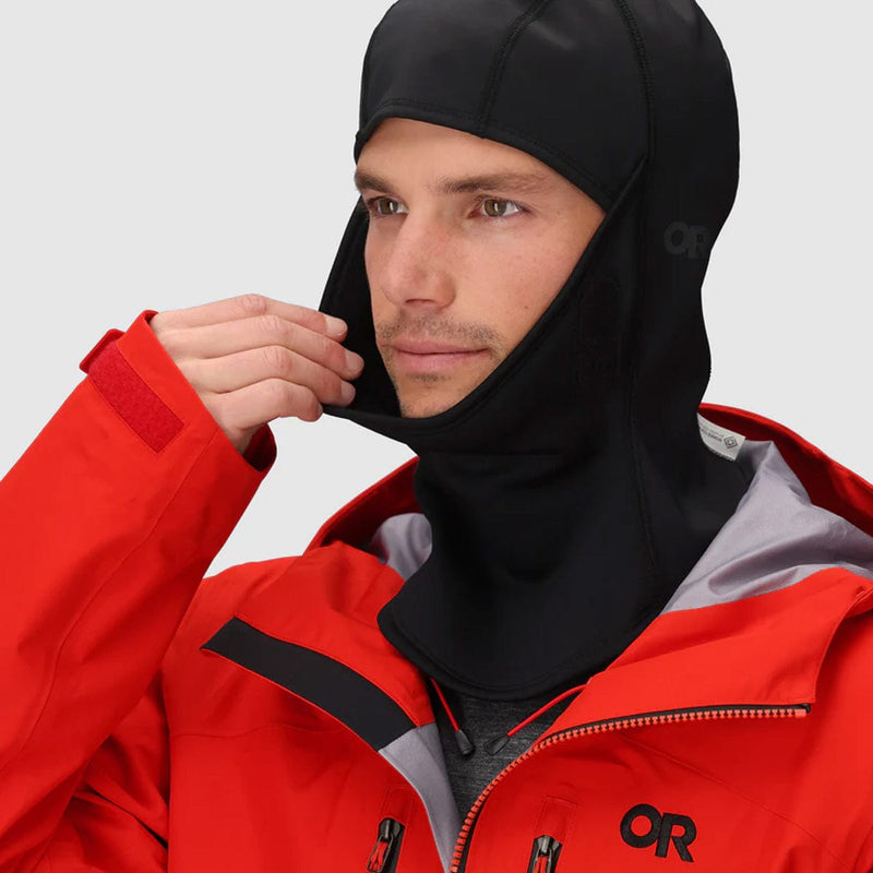 Load image into Gallery viewer, Person wearing a red and gray jacket with a black hood, featuring the OR logo.
