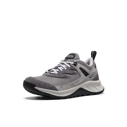 Gray athletic shoe with white laces on a white background