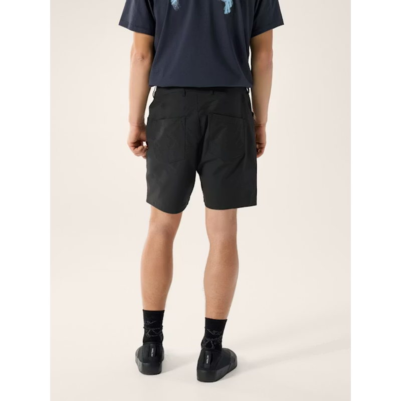 Load image into Gallery viewer, Person wearing black shorts and black shoes on a white background
