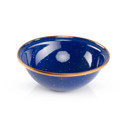 Blue enamel bowl with gold rim on a white background