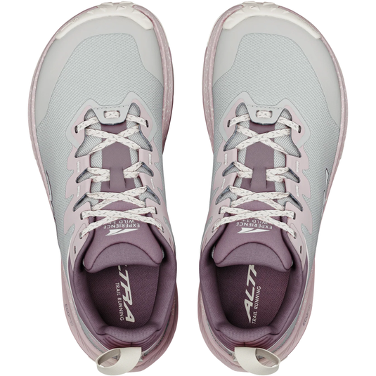 Pair of gray and purple running shoes with white laces on a white background
