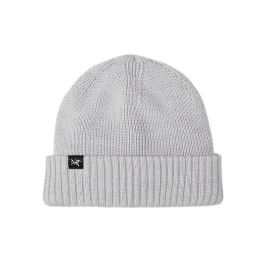 Gray beanie with a brand logo on a white background