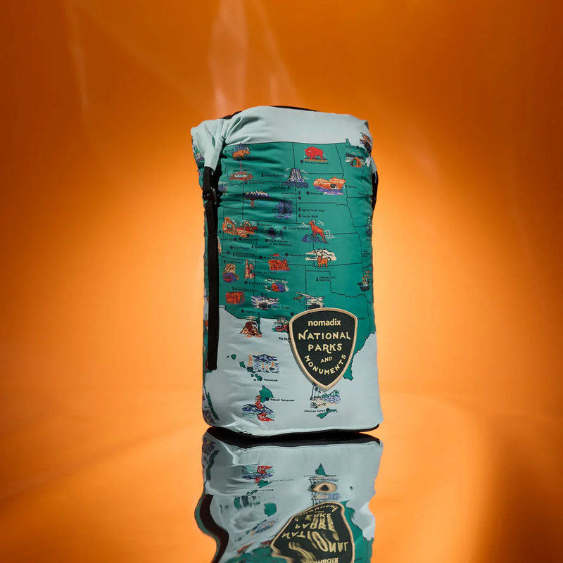 Load image into Gallery viewer, Green and gray bag with national park design on an orange background

