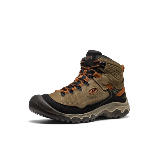 Brown hiking boot with orange accents on a white background