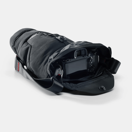 Camera with protective cover on a white background