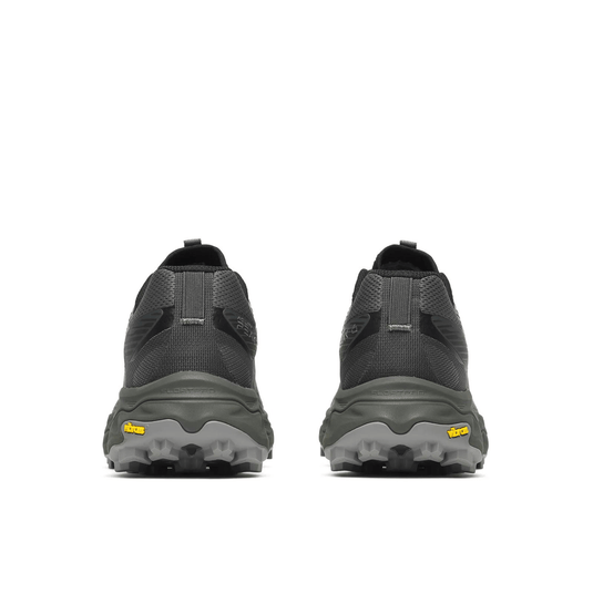 Pair of gray hiking boots with visible brand logo on a white background