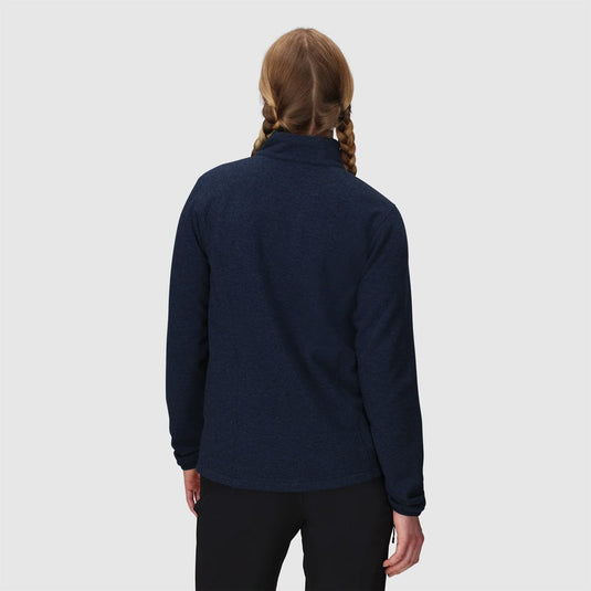 Person wearing a navy blue fleece jacket on a white background