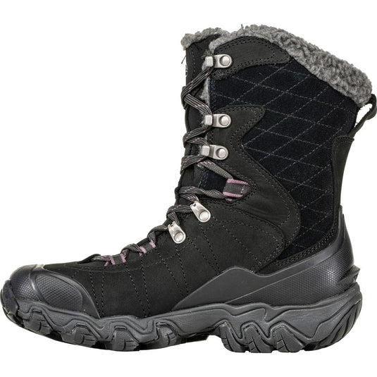 Black winter boot with quilted design and gray fur lining on a white background