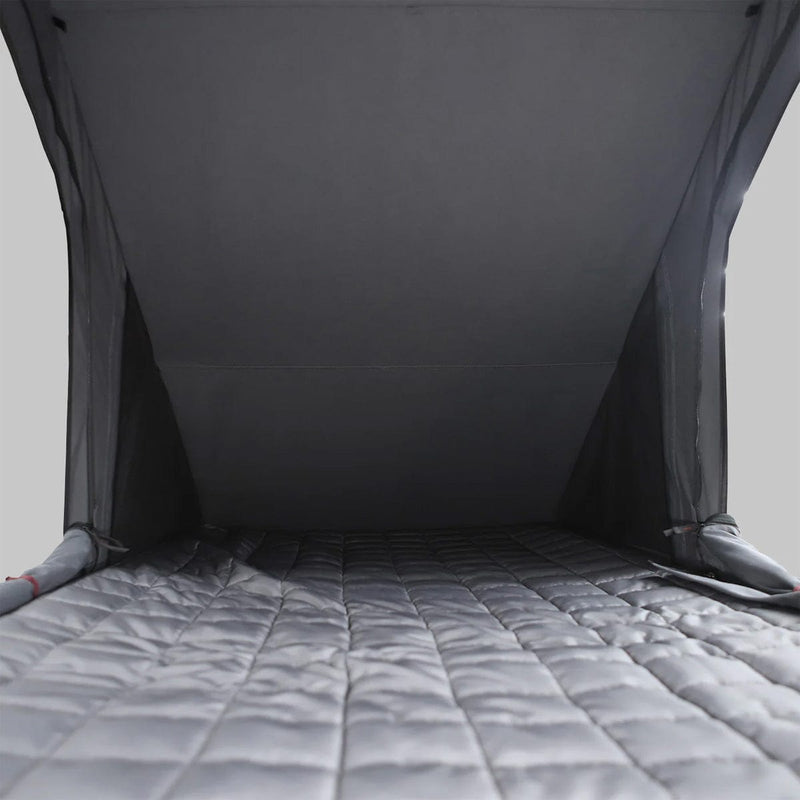 Load image into Gallery viewer, Gray quilted mattress with a dark gray tent-like structure on a light gray background

