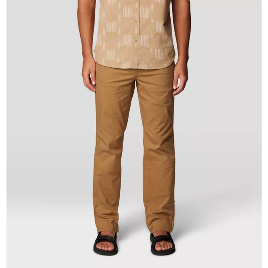 Person wearing a beige patterned shirt and brown pants on a white background