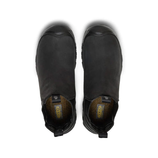 Pair of black boots on a white background